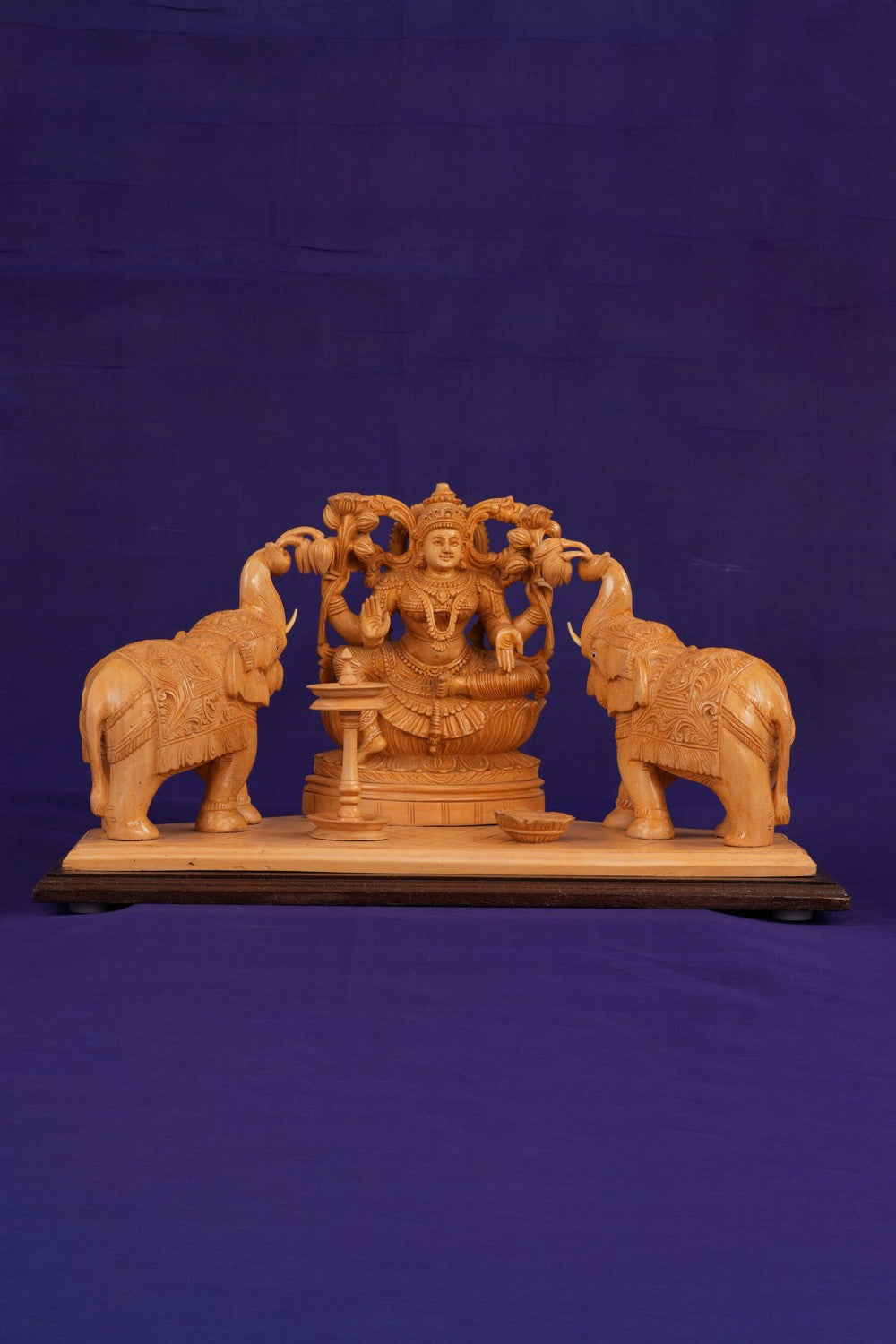 Image of White Cedar Wooden MahaLakshmi Statue With Elephants